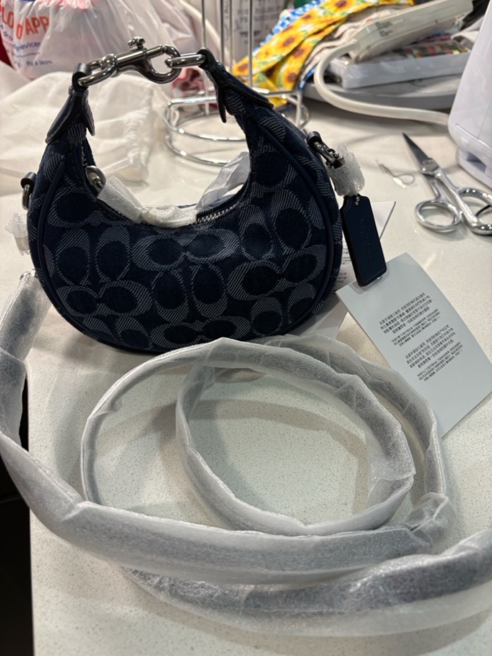 Coach Mini Crescent Crossbody Bag in denim blueish/black